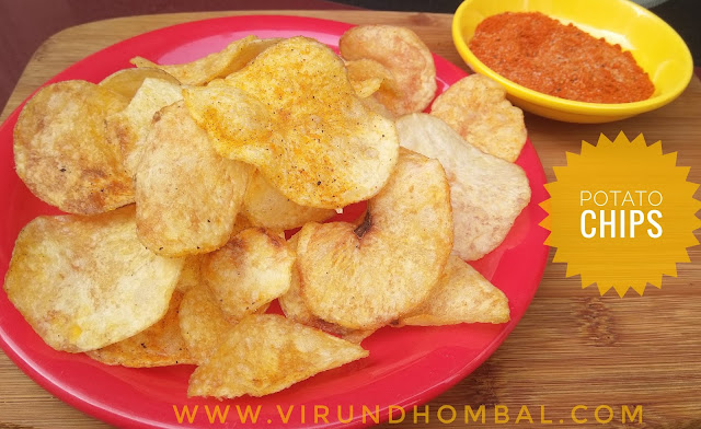 Potato Chips - Potato chips - yummy homemade chips recipe for your kids. Many different kinds of potato chips are available in stores with different flavours and shapes. But homemade products are always safe for us. Do you agree? Tell your kids why homemade snacks are better than store bought snacks. The potato is a commonly used vegetable in our kitchen and you can prepare these chips when you have free time. The potatoes are sliced thinly and then soaked in the water for 20 to 30 minutes to remove the starch in it. After 20 minutes, the slices are dried in a white cloth for 2 hours without any moisture. This method helps to get a  crispy chips. Soaking and drying the slices are the important steps that you must follow for this potato chips. Once the slices are dried without any moisture, then they are deep fried on low heat. For deep frying little patience is very important to get perfect results. Don’t be hurry to finish the frying process, because the chips will turn soggy or you will get a brown colour chips. The final procedure is the seasoning step and you can add your favourite flavours as you wish.