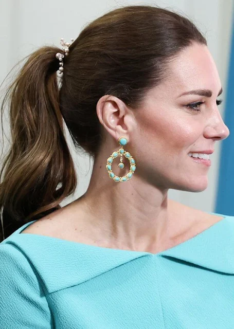 Kate Middleton wore a bespoke aquamarine fitted dress by Emilia Wickstead. Sezane Taylor earrings in turquoise