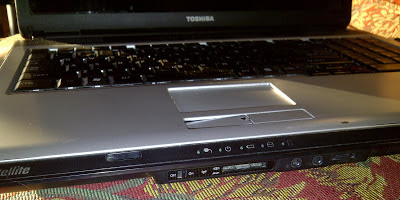 Shows SD card slot on laptop