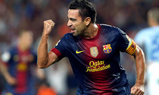 Xavi saat mencetak gol kegawang Granada