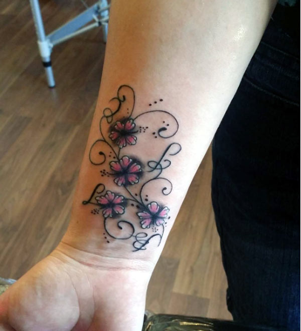 Cute and lovely wrist tattoo ideas pretty flowers tattoo designs on the wrist for momen