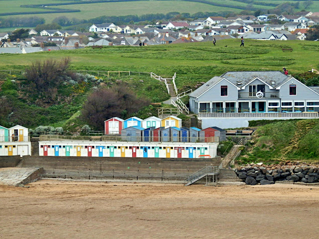 Beach huts and beach at Bude, Cornwall