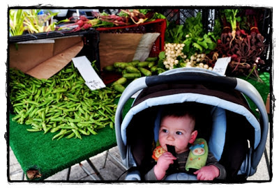 peas and toddler at farmer's market