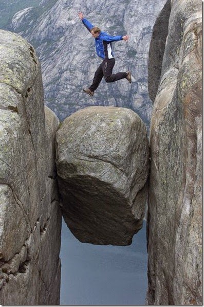 man-jumping-on-preikestolen-rock-norway-kjerag-lysefjord