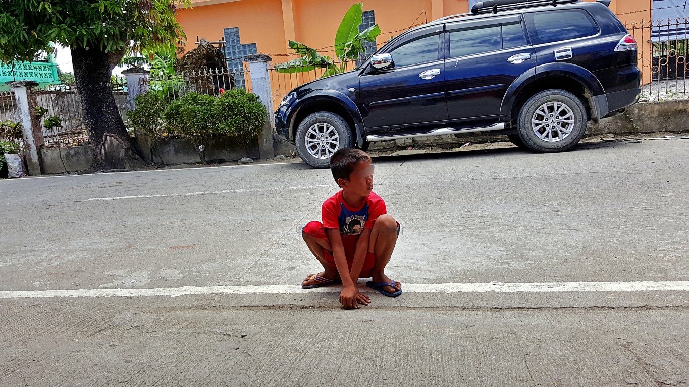 beggar boy at SAVE Meal & Snack Zone, Arteche Eastern Samar