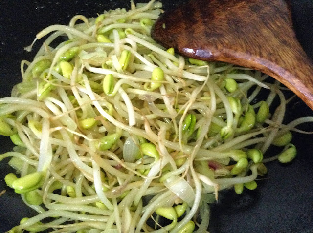 Soy sprouts added to the wok