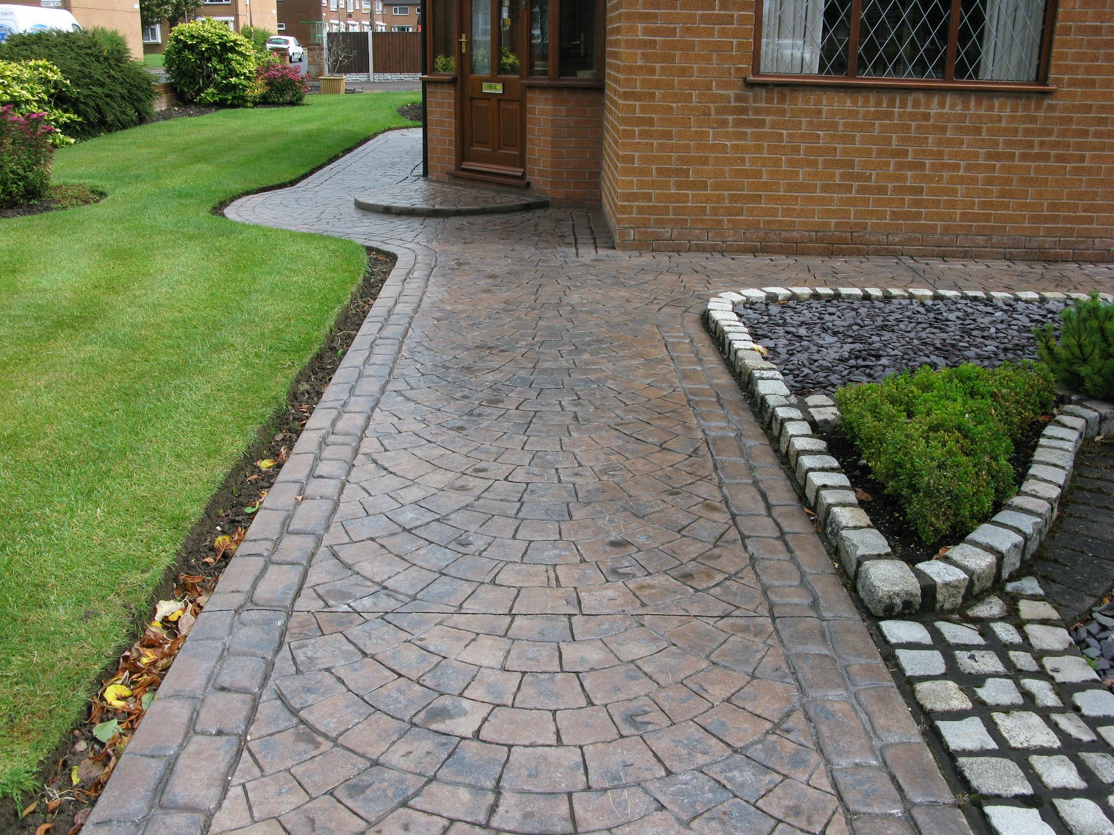 Stamped concrete, often called textured or imprinted concrete, replicates stones, such as slate and for example, if your house has a brick exterior, consider echoing that theme with a simple. Northern Cobblestone Blog How Is Pattern Imprinted Concrete Created