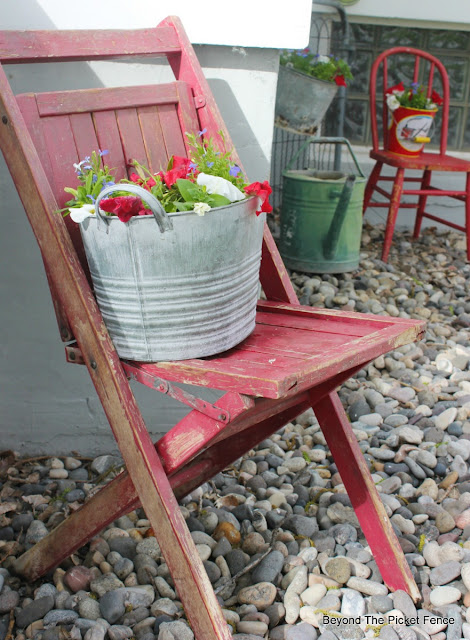 junk planter, garden junk, flowers, annuals, metal bucket, state fair chair, upcycled, http://bec4-beyondthepicketfence.blogspot.com/2016/05/junk-planters.html