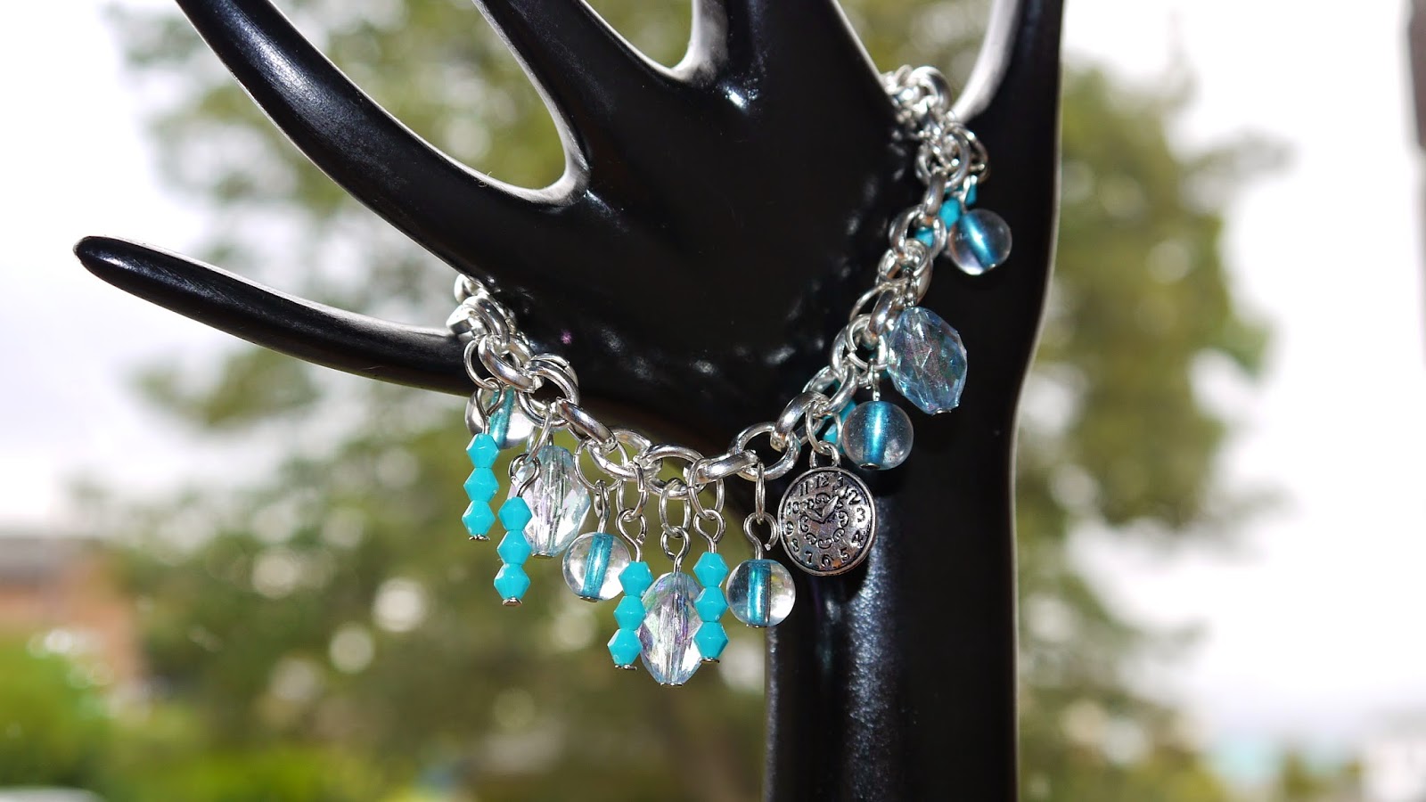 http://folksy.com/items/6504138-Clock-Blue-Charm-Bracelet