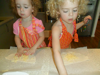 Sprinkle grated cheese on top of tortilla for quesadilla