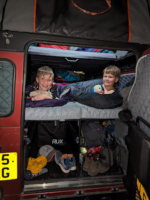 Kids sleeping in a Land Rover Defender Camper