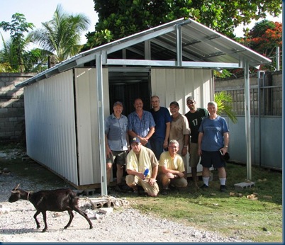 Team picture in front of house