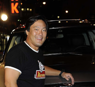 Polly Tsai's husband Ming Tsai posing for picture