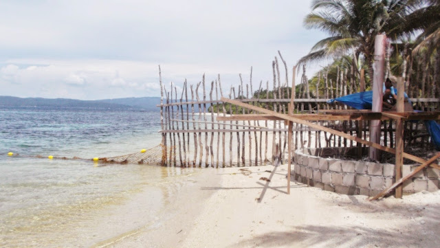 Lagbangan fenced the beach itself all the way to the sea. That is illegal.