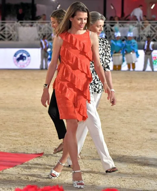 Carlotte Casiraghi wore a coral silk jacquard dress by Chanel. Princess Caroline, Dimitri Rassam and Princess Alexandra