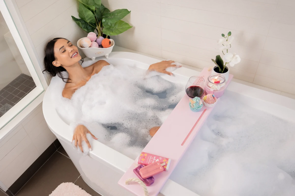 relaxed smiling woman taking  a bubble bath
