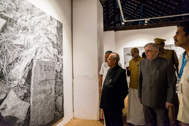 President Pranab Mukherjee watching Indian artist Gauri Gill's photo exhibition 'Traces' at Aspinwall House during his visit to Kochi Biennale. Kerala Governor Chief Justice (Retd) Shri  P Sathasivam , Chief Minister Shri Pinarayi Vijayan, former Minister M A Baby and  Kochi Biennale 2016 curator Sudarshan Shetty are seen along.