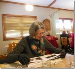 Joan looking at book
