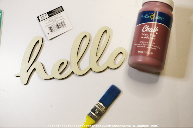 hello sign with paintbrush and acrylic paint