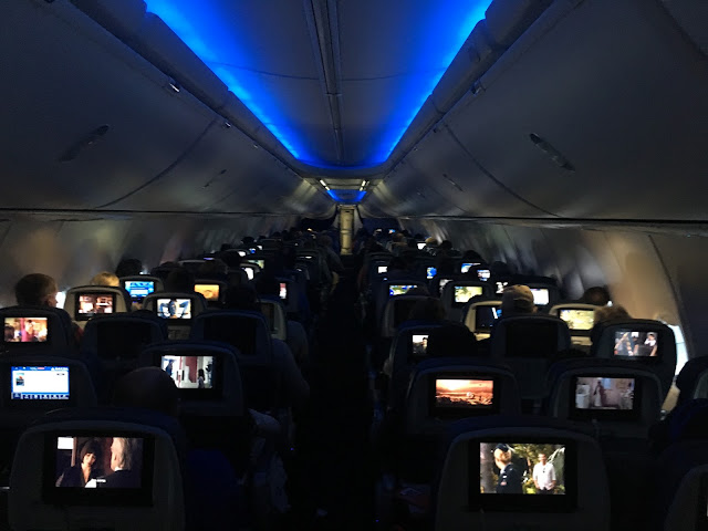 inside of airplane with lights down