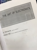 The Art of Electronics, by Horowitz and Hill, superimposed on Intermediate Physics for Medicine and Biology.