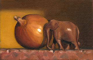 Still life oil painting of a small, carved wooden elephant beside a brown onion.