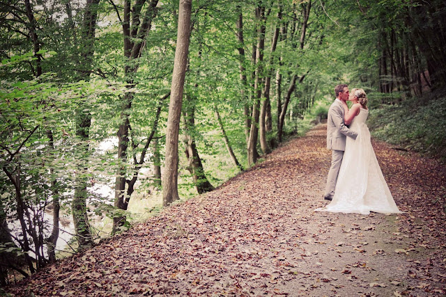 A bride and a groom in a forest in France