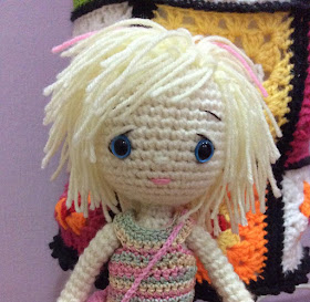 Crochet doll with blue eyes short blonde and pink hair