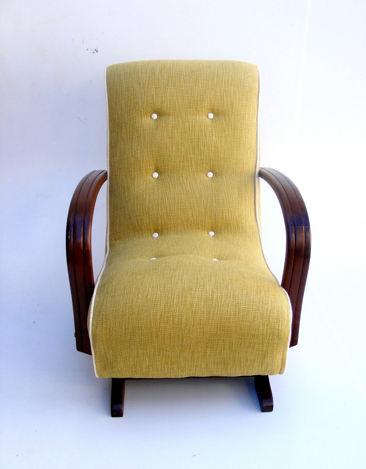 pair of rocking Banana chairs in green with creampiping and buttons 