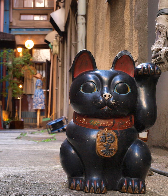 Maneki Neko in street in Japanese village