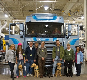 Paws for Independence puppies-in-training tour the Kenworth Renton truck plant in WA.