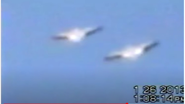 Silver metallic looking Flying Saucer UFOs in formation over Mexico.