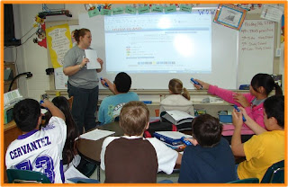 students in a classroom viewing an internet page on a projector. Mr. Winkle would not feel at home in this classroom.