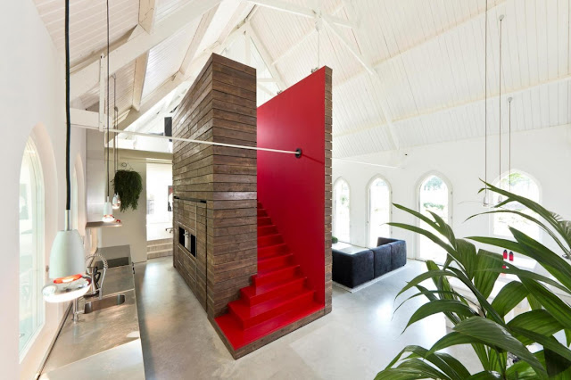 Picture of wooden structure with red staircase to the mezzanine floor