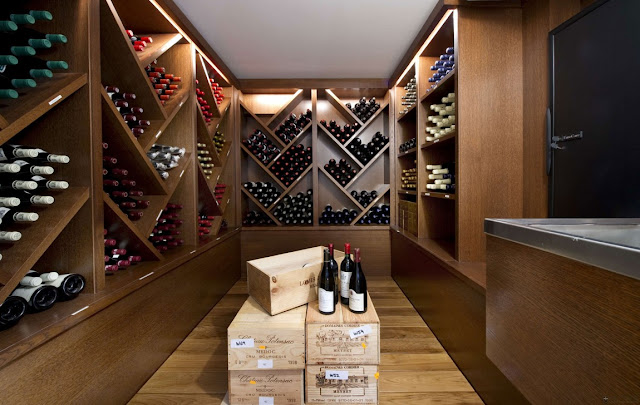 Nice small modern vine cellar with brown shelves 