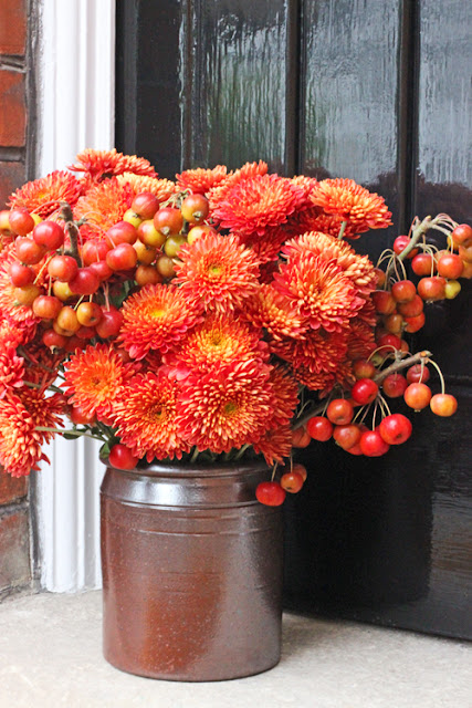 Orange Chrysanthemums and crabapples