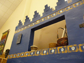 Blue wall with window and baskets