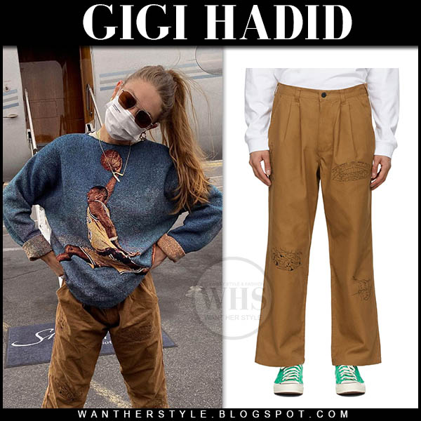 Gigi Hadid in khaki trousers and grey sweater
