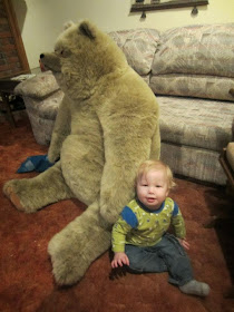 baby and giant stuffed teddy bear