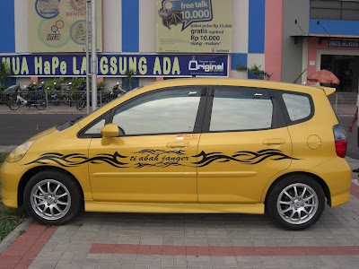 New Yellow Honda Jazz With tribal Sticker-Best Car Sticker Collection