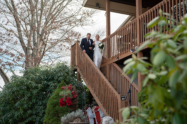 Bride and father walking down wooden staircase Magnolia Farm Asheville Wedding Photography captured by Houghton Photography