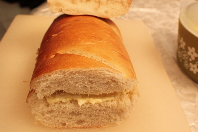 filling of egg salad in a whole loaf of bread