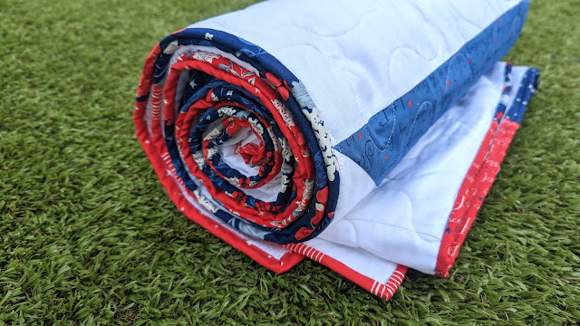 Giant star picnic quilt using red, white, and blue fabrics