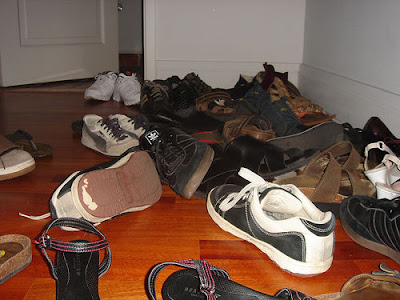 Shoes piled up in the