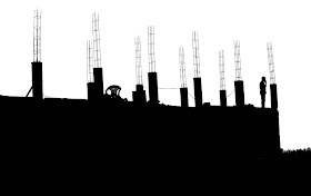 silhouette of building under construction