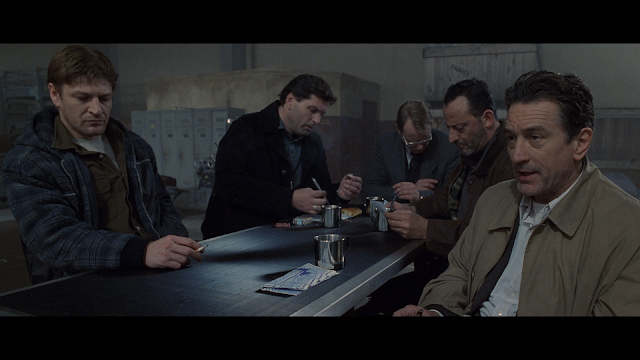 Robert De NIro, Sean Bean, Jean Reno, and company sitting around a table