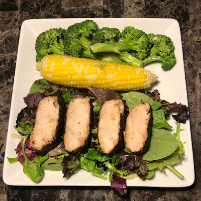 Garlic and olive oil marinated grilled pork tenderloin, steamed broccoli and grilled corn on the cob