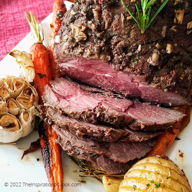 Pink slices of boneless leg of lamb, medium rare