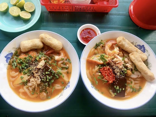 Two bowls of Banh Canh Cua at Banh Canh Cua 87 in Tan Dinh Ward