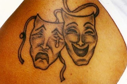 The tragedy and comedy masks are a popular tattoo design especially among 